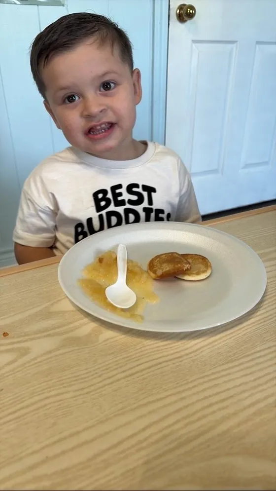 A child enjoying a meal at Bright Haven