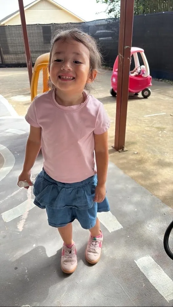 A smiling child outdoors at Bright Haven